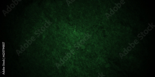 Green wall background with grunge texture, watercolor painted mottled green background, colorful bright ink and watercolor textures on black paper background.