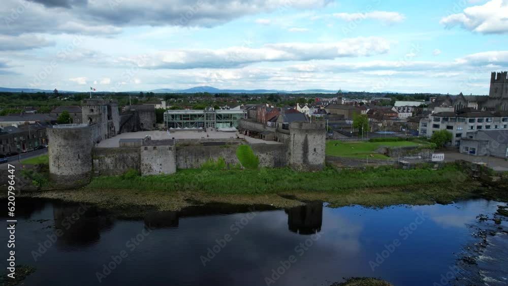 Aerial view over King John's Castle in scenic Limerick, Ireland. Sideways shot Aerial view over King John's Castle in scenic Limerick, Ireland. Sideways shot