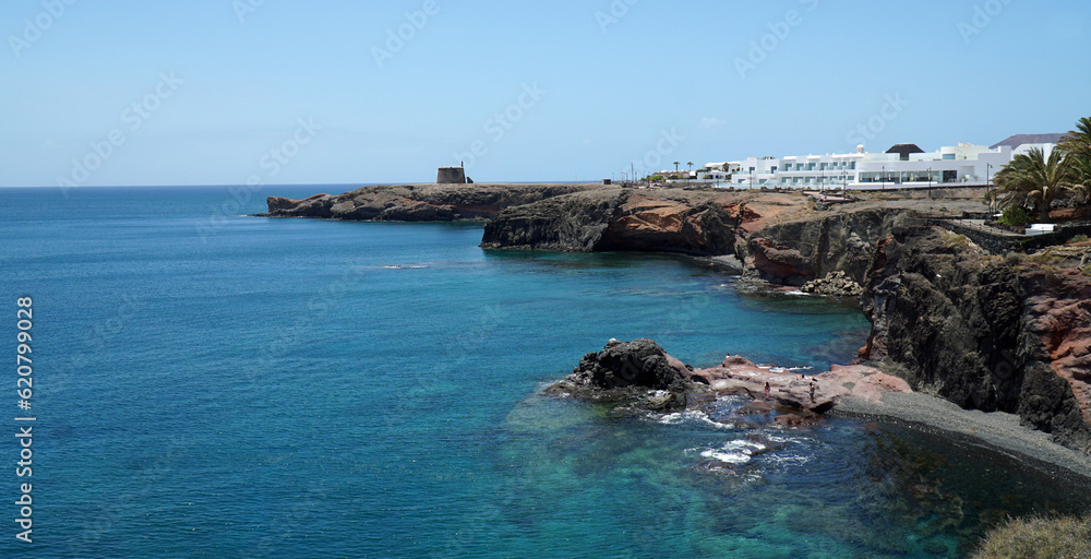 Old Napolionic Fort and hotel on cliff top at Playa Blanca Lanzarote Spain.