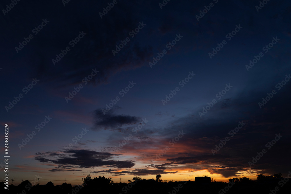 Fototapeta premium silhouettes of against dramatic sky in sunset, dawn, late evening hours