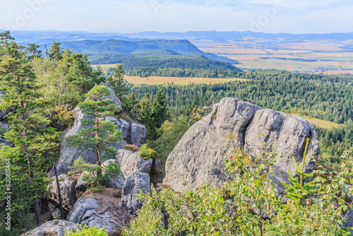 View from the red hiking trail near Szczeliniec Wielki towards Broumovské stěny (Koruna in the background) in the Central Sudetes in the Stolowe Mountains (Poland) photo