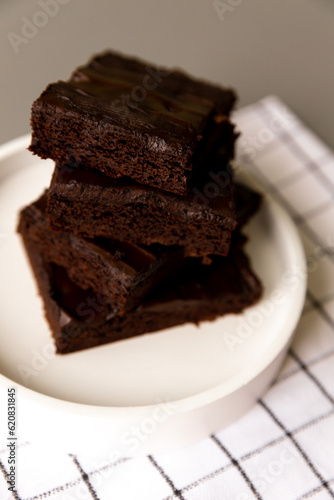 Chocolate brownies laid out on a plate  cake. Healthy banana and cocoa dessert. Health and weight care