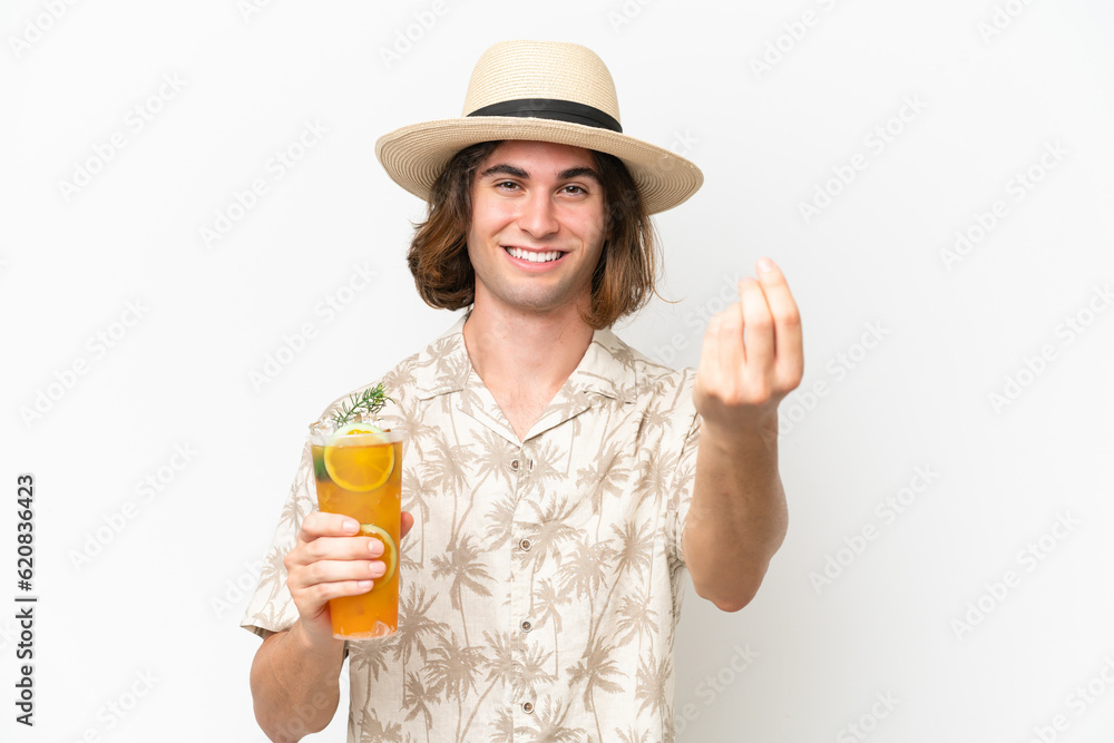 Young handsome man holding a cocktail isolated on white background making money gesture Young handsome man holding a cocktail isolated on white background making money gesture
