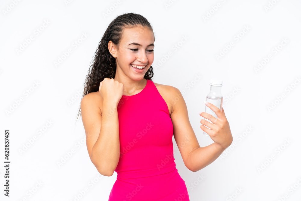Young sport woman with a bottle of water isolated on white celebrating a victory Young sport woman with a bottle of water isolated on white celebrating a victory