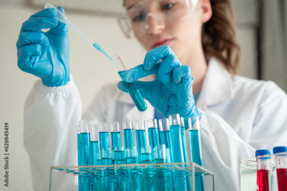 Medical test vaccine research and development concept. Scientist in laboratory study and analyze scientific sample of antibody. Medical test vaccine research and development concept. Scientist in laboratory study and analyze scientific sample of antibody.
