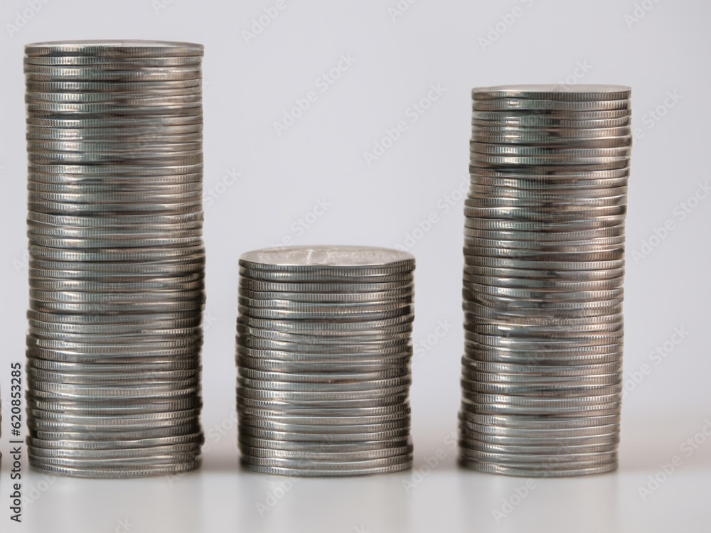 Stacks of silver coins of different height