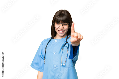 Little girl as a surgeon doctor over isolated chroma key background showing and lifting a finger
