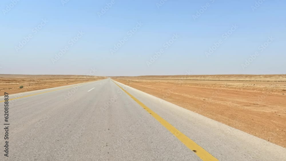 Saudi Arabia: Driving car on road in middle of Arabian Desert - landscapes of Arabian Peninsula Saudi Arabia: Driving car on road in middle of Arabian Desert - landscapes of Arabian Peninsula