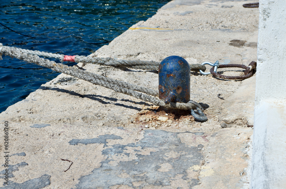 Fototapeta premium Bollard and ropes for mooring at a quay on the island Malta.