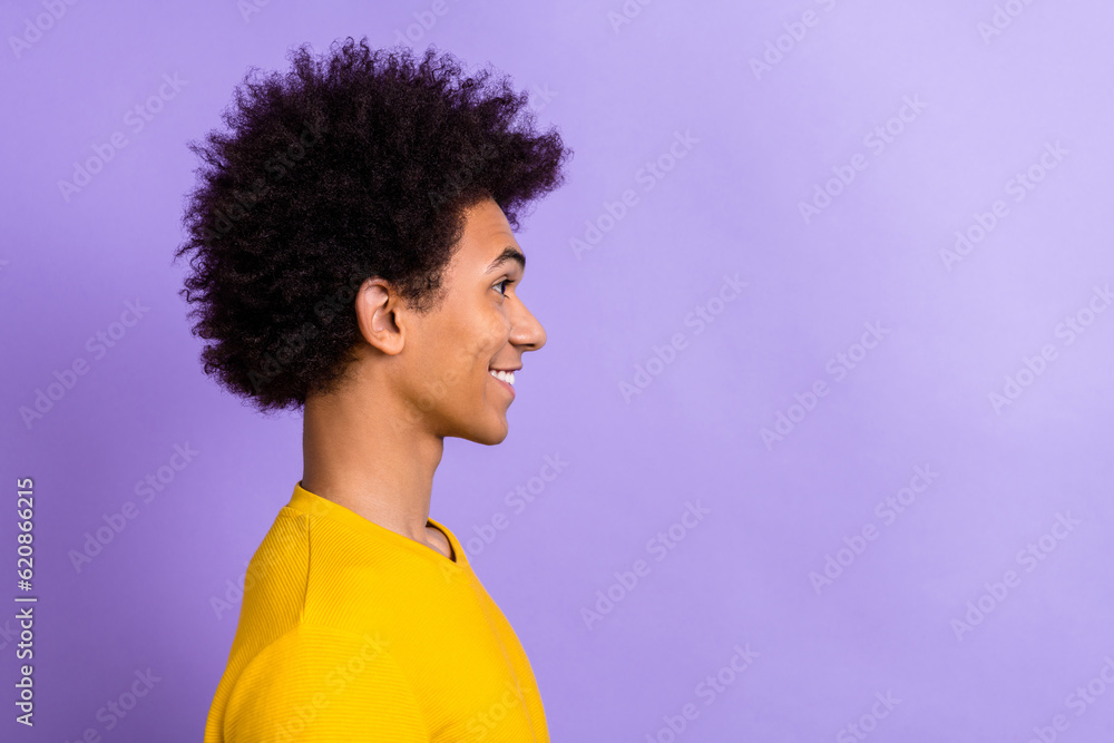 Side profile cadre of happy smiling guy wear trendy t-shirt looking empty space satisfied his hairdress isolated on purple color background Side profile cadre of happy smiling guy wear trendy t-shirt looking empty space satisfied his hairdress isolated on purple color background