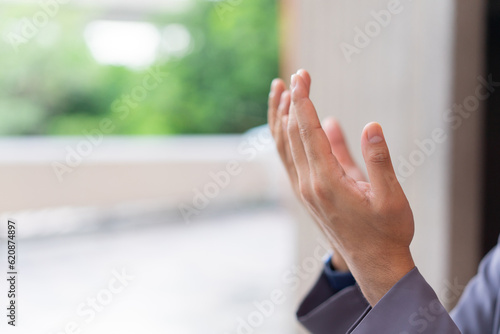 close up adult muslim prayer man hand praying at mosque for religion and believe concept 