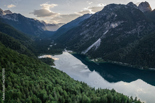 Predil Lake and Alpine mountains landscape in Italy. Aerial drone view