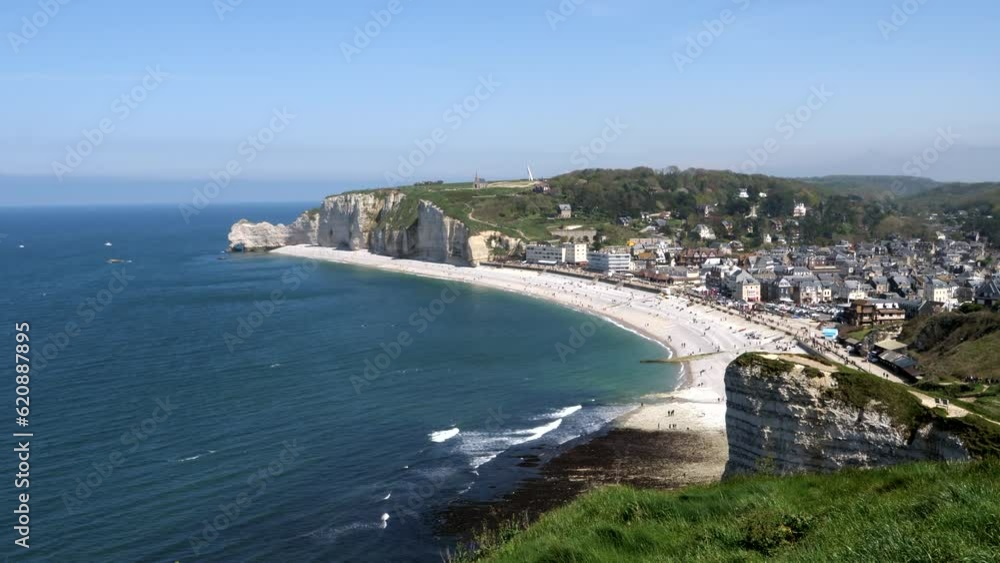 Panorama drone shot of sandy beach and famous sea cliffs in Etretat during summer day. France, Europe Panorama drone shot of sandy beach and famous sea cliffs in Etretat during summer day. France, Europe