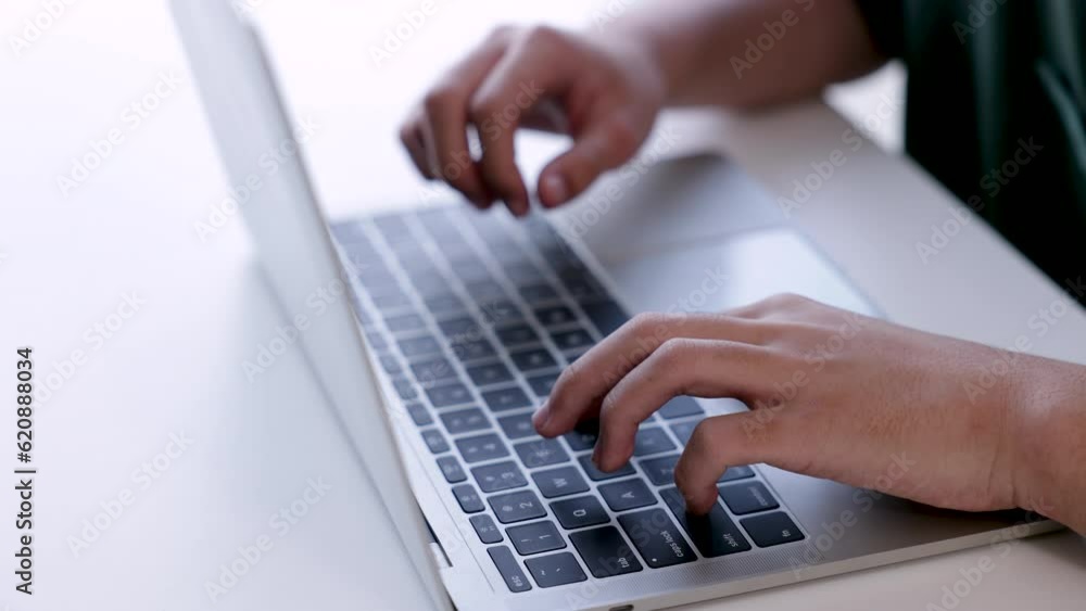 Close-up hand typing computer on keyboard for studying in private course , man working on laptop typing message to customers or meeting with colleagues in co-working space, lifestyle modern working Close-up hand typing computer on keyboard for studying in private course , man working on laptop typing message to customers or meeting with colleagues in co-working space, lifestyle modern working