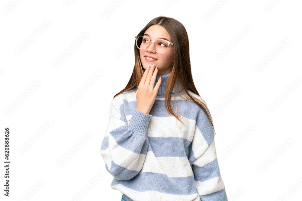Teenager girl over isolated chroma key background looking up while smiling Teenager girl over isolated chroma key background looking up while smiling