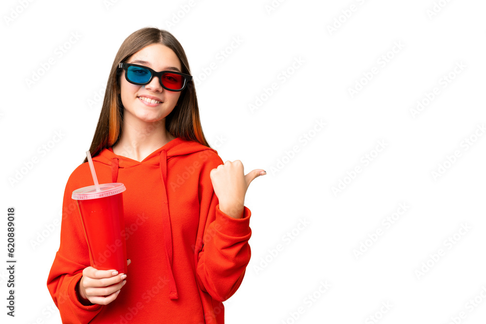 Teenager girl in a cinema over isolated chroma key background pointing to the side to present a product - obrazy, fototapety, plakaty 