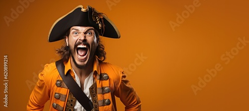 Young Man Dressed as a Pirate for Halloween on an Orange Banner with Space for Copy