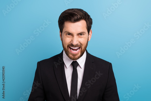 Photo of furious mad specialist dressed black suit screaming loud isolated blue color background