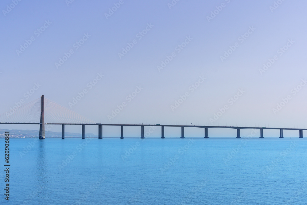 calm waterway bridge against a flat waterway