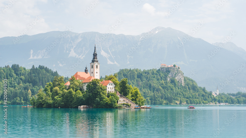  Beautiful panorama of the Bled Lake on a sunny day and with blue tones on the water 