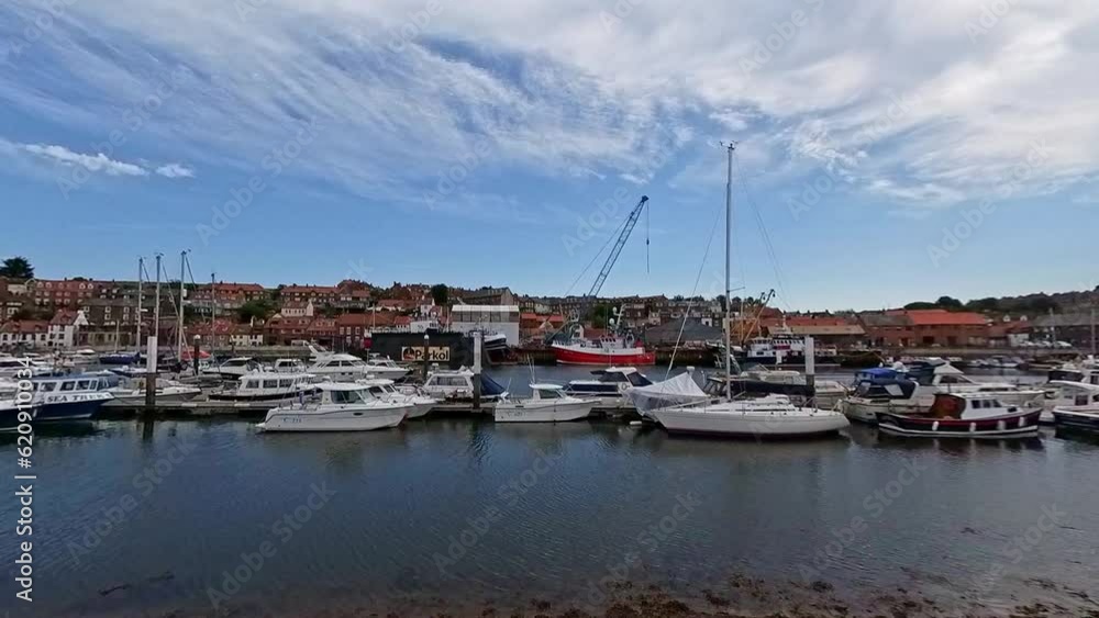 Sailboats and yachts in the marina in the seaside town of Whitby on the North Yorkshire coast. Captured on a bright and sunny summer day Sailboats and yachts in the marina in the seaside town of Whitby on the North Yorkshire coast. Captured on a bright and sunny summer day