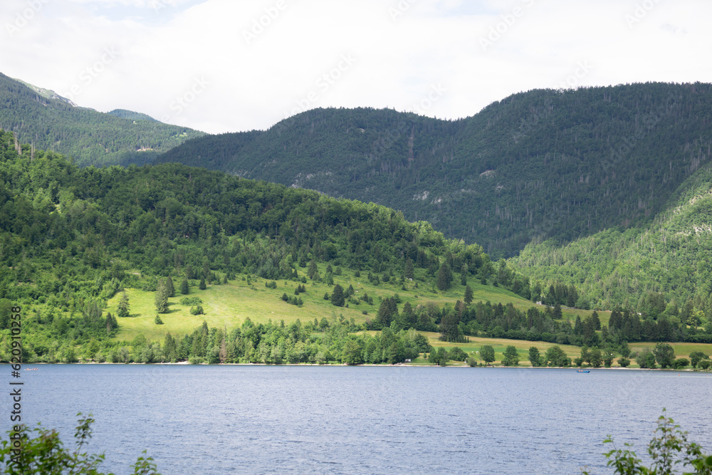 Panorama of the mountains with a lake on a cloudy day