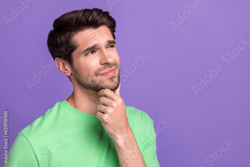 Portrait of ponder serious guy brunet hair touch chin minded look novelty deep think unshaved stubble isolated on purple color background © deagreez