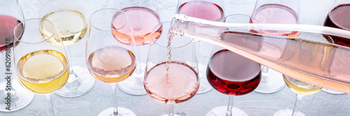 Canvas Print Rose wine poured into a glass at a tasting panorama