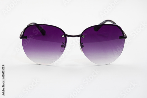 Fashionable sunglasses for women. burgundy glass. beautiful shape. Women's accessory.on a white isolated background.
