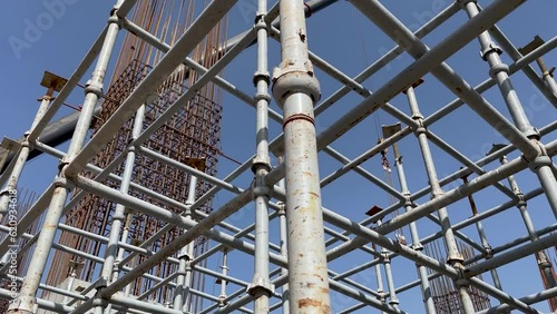 scaffolding around reinforced concrete structure and reinforcement cage