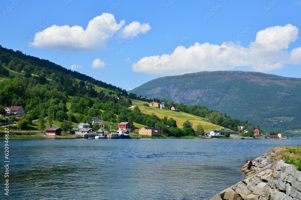 Scenic view of the coast from the water sailing through a Norwegian fjord.
