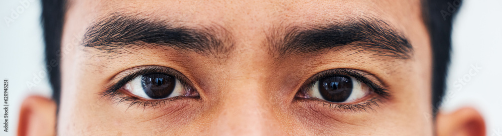 Obraz premium Portrait, closeup and eyes of man for vision, focus and healthcare with medical test for contact lenses or eyesight. Zoom, eye exam and iris of model looking, lens care and wellness for healthy sight