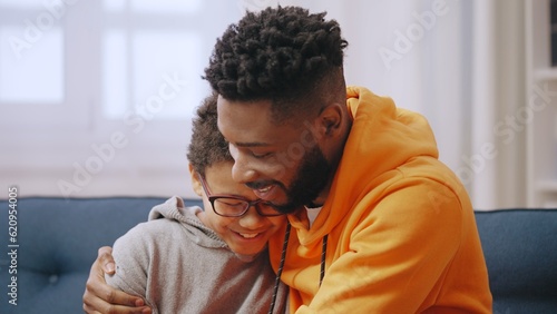 Foto Happy big and little brother hugging and smiling, family love and care, relation