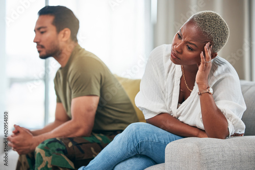 Separation, conflict and couple on a couch, ignore and anger with depression, argument and divorce. Relationship, black woman or Asian man on a sofa, fighting and angry with a dispute, home and upset