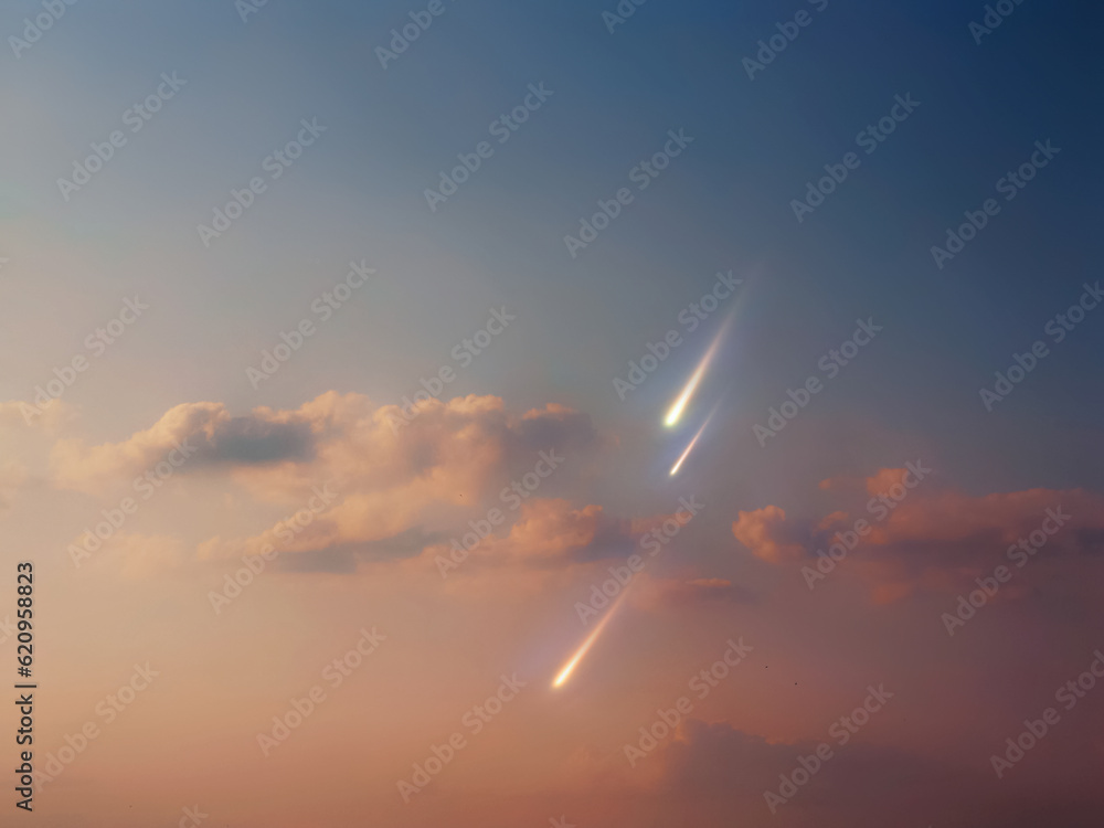 Fireballs in the daytime sky at sunset. Falling meteors in the light of the sun.