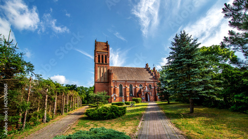 Fototapeta Naklejka Na Ścianę i Meble -  General view and architectural details of the Neo-Gothic Catholic Church of St. Joseph in Kobułty, Masuria, Poland.