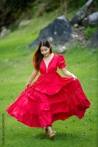 woman in red dress in the park, Happy woman, Asian woman in red dress in the park, woman run in gress