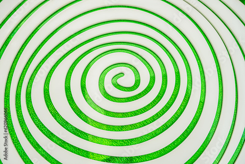 Simple white spiral on green Sparkling background