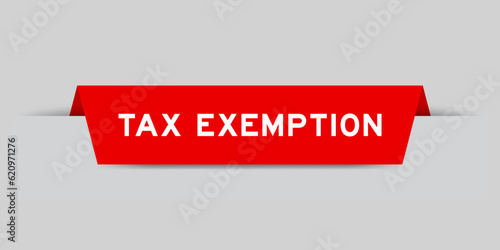 Red color inserted label with word tax exemption on gray background