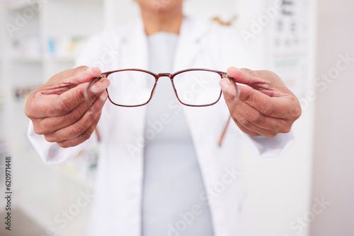 Glasses in hands, vision and eye care, health with eyesight test and optometry, prescription lens and designer frame. Ophthalmology, focus and healthcare, person in optometrist clinic and eyewear