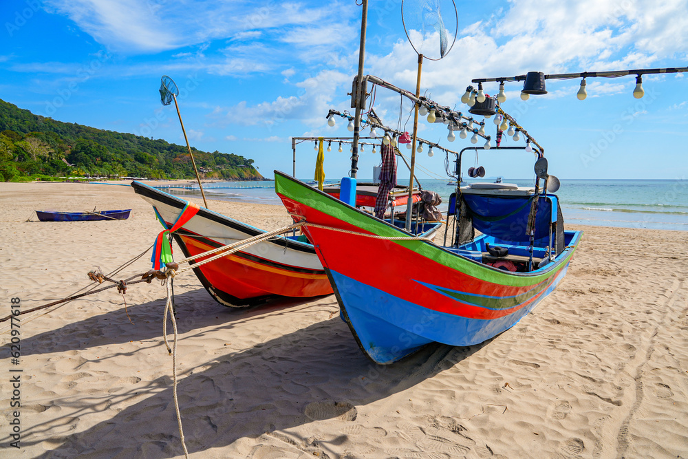 Colorful fishing boat stranded on the sand of Ba Kantiang Beach on Koh Lanta island in the Andaman Sea, Krabi Province, Thailand