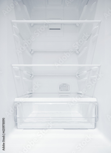 An empty refrigerator. Inside an empty, clean refrigerator, a refrigerator compartment after defrosting. shot with a wide angle lens
