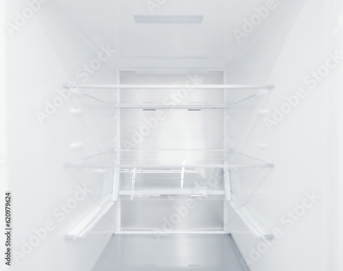 An empty refrigerator. Inside an empty, clean refrigerator, a refrigerator compartment after defrosting. shot with a wide angle lens