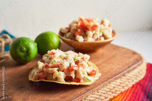 Close up of a delicious tostada of ceviche. Concept Peruvian food, mexican food. photo