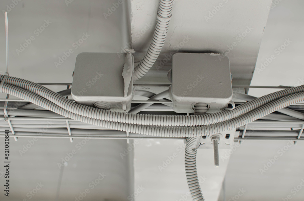 electrical distribution box above the suspended ceiling.Junction box and outgoing power cables. electrical distribution box above the suspended ceiling.Junction box and outgoing power cables.