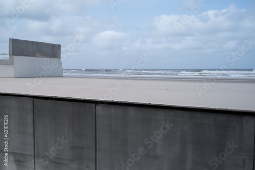 Building shell concrete at the beach of the sea with blue sky and clouds