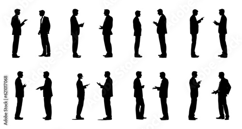 silhouette of two businessmen standing discussing, debating, negotiation