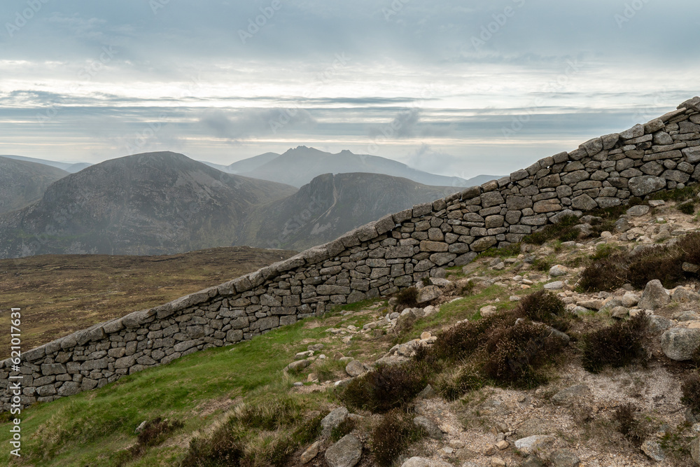 Panoramic view of typical Irish landscape, fields, sea in background. Picture taken from the top of Mourne mountains