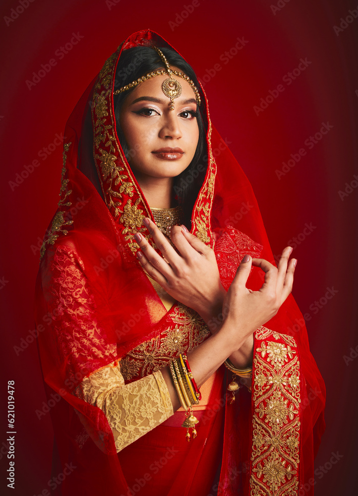 Fashion, hand sign and portrait of Indian woman with veil in traditional clothes, jewellery and sari. Religion culture, beauty and female person on red background with accessory, cosmetics and makeup
