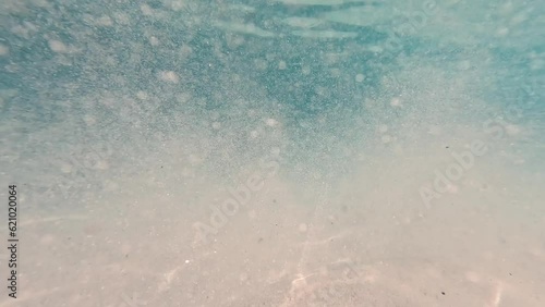 Glittering sands deep sea underwater in Maldives Indian Ocean